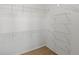 Walk-in closet with wire shelving and neutral carpet at 3853 S Malta St, Aurora, CO 80013