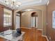 Spacious foyer with hardwood floors and natural light provides a warm and welcoming entry at 3853 S Malta St, Aurora, CO 80013