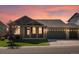 Charming single-Gathering home boasting a manicured lawn and a two-car garage against a backdrop of a beautiful sunset at 3853 S Malta St, Aurora, CO 80013