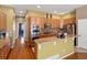 Modern kitchen with wooden cabinets, breakfast bar and stainless steel appliances at 3853 S Malta St, Aurora, CO 80013