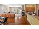 Open living room with fireplace, wooden floors, and views of a bright sitting room at 3853 S Malta St, Aurora, CO 80013