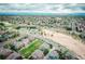 A great aerial view showcases this vibrant neighborhood with tennis courts and a large sandy park nearby at 1645 Wabash St, Denver, CO 80220