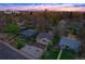 Aerial view of the home, showcasing the neighborhood, landscaping, and rooftop at 1645 Wabash St, Denver, CO 80220