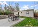 Backyard features a concrete patio, dining set, outdoor seating, and garden at 1645 Wabash St, Denver, CO 80220