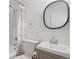 Classic bathroom with white subway tiles, a shower-tub combination, and a neutral-toned vanity at 1645 Wabash St, Denver, CO 80220