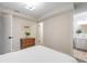 Bright bedroom features neutral walls, a queen bed, and ensuite bathroom at 1645 Wabash St, Denver, CO 80220