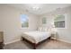 Bright bedroom features two windows, a full bed, and natural light at 1645 Wabash St, Denver, CO 80220