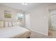 Bright bedroom features a closet and ensuite bathroom at 1645 Wabash St, Denver, CO 80220