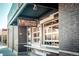 Stylish Four Friends Kitchen exterior featuring a modern design with brick accents and a welcoming outdoor serving window at 1645 Wabash St, Denver, CO 80220