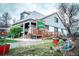 Charming Coffee House features a covered porch, wheelchair ramp, and inviting outdoor seating area at 1645 Wabash St, Denver, CO 80220