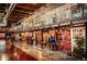 An interior view of Stanley Marketplace featuring various restaurants and vendors under a well lit atrium at 1645 Wabash St, Denver, CO 80220