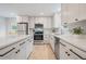 Bright kitchen with quartz countertops, stainless steel appliances, and ample cabinet space at 1645 Wabash St, Denver, CO 80220