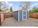 Backyard shed with clean lines, painted a calming blue with white trim at 1645 Wabash St, Denver, CO 80220