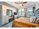 Bedroom featuring a large bed, ample natural light, and city views at 1727 N Pearl St # 107, Denver, CO 80203