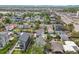 This aerial view showcases the area's residential properties and the distant mountain views at 2143 S Acoma St, Denver, CO 80223