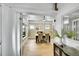 Elegant dining room with hardwood floors, a fireplace, and large windows at 2143 S Acoma St, Denver, CO 80223