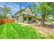 Beautiful two-story home with a well-manicured lawn and mature trees at 2143 S Acoma St, Denver, CO 80223