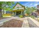 Charming two-story home with a covered front porch and well-maintained landscaping at 2143 S Acoma St, Denver, CO 80223