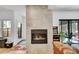 Modern fireplace with sleek tile surround, located near the patio door and gaming machine at 2143 S Acoma St, Denver, CO 80223