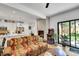 Open-concept living room with fireplace, adjacent to the kitchen and outdoor patio at 2143 S Acoma St, Denver, CO 80223