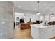 Spacious living room is open to the kitchen and features a gray fireplace at 2143 S Acoma St, Denver, CO 80223