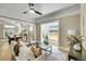 Inviting living room with an open layout, hardwood floors, and neutral decor at 2143 S Acoma St, Denver, CO 80223