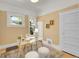 Charming home office space with ample natural light and hardwood flooring at 2143 S Acoma St, Denver, CO 80223