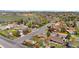 Aerial view of a neighborhood showcasing the surrounding community and a glimpse of distant mountains at 2698 Fern Dr, Westminster, CO 80030