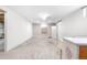 Large carpeted basement featuring a piano and a window providing natural light and ventilation at 2698 Fern Dr, Westminster, CO 80030