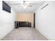 Bedroom with carpet flooring, standard ceiling fan, and dark-toned dresser with a beige accent wall at 2698 Fern Dr, Westminster, CO 80030
