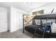 Cozy bedroom features carpet and built-in closet, with a black metal framed bunk bed and window at 2698 Fern Dr, Westminster, CO 80030