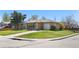 A charming brick home features an attached garage, a green lawn, and easy street access at 2698 Fern Dr, Westminster, CO 80030