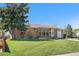 Inviting brick home with mature tree, green lawn, and convenient driveway access at 2698 Fern Dr, Westminster, CO 80030