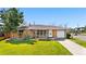 Charming single-story brick home with a well-maintained lawn and mature landscaping at 2698 Fern Dr, Westminster, CO 80030