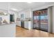 Functional kitchen with access to a deck via sliding glass door, blending indoor/outdoor living at 2698 Fern Dr, Westminster, CO 80030