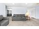 Spacious living room featuring seamless transition to dining area and ample natural light at 2698 Fern Dr, Westminster, CO 80030