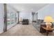Comfortable living room featuring large window, neutral carpeting and cozy seating at 2698 Fern Dr, Westminster, CO 80030