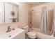Traditional bathroom features a standard shower-tub combination and contemporary vanity at 8228 Marshall Ct, Arvada, CO 80003