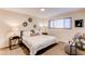 Cozy bedroom with a comfortable bed, stylish side tables, and ample natural light at 8228 Marshall Ct, Arvada, CO 80003