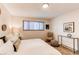 Bright bedroom with a comfortable bed, stylish side tables, and natural light at 8228 Marshall Ct, Arvada, CO 80003