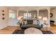 Cozy living room featuring a modern sofa, throw pillows, and view of the outdoor space at 8228 Marshall Ct, Arvada, CO 80003