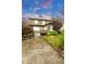 Exterior backyard showcasing a well-maintained lawn, stone patio, and a small wooden deck offering outdoor enjoyment at 6334 Empire Ave, Frederick, CO 80516
