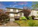 Charming backyard featuring a well-maintained lawn, lush landscaping, and a wooden deck offering an inviting outdoor space at 6334 Empire Ave, Frederick, CO 80516