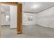 Unfinished basement featuring concrete floors, insulated walls, and a window providing natural light at 6334 Empire Ave, Frederick, CO 80516