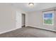 Bedroom with neutral walls, carpet, and closet with sliding doors at 6334 Empire Ave, Frederick, CO 80516