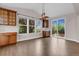Dining area includes wood cabinets, a large window, and sliding doors to an outdoor deck at 6334 Empire Ave, Frederick, CO 80516