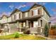 Charming two-story home featuring stone accents, a covered porch, and a well-manicured lawn in a Gathering-friendly neighborhood at 6334 Empire Ave, Frederick, CO 80516
