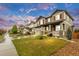 Beautiful two-story home on a tree-lined street, showcasing its landscaped front yard and inviting curb appeal at 6334 Empire Ave, Frederick, CO 80516