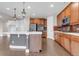 Kitchen featuring stainless appliances, a modern island, and wooden cabinets at 6334 Empire Ave, Frederick, CO 80516