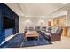 Cozy basement with entertainment area, wet bar, and comfortable leather seating at 11421 Belle Meade Dr, Conifer, CO 80433